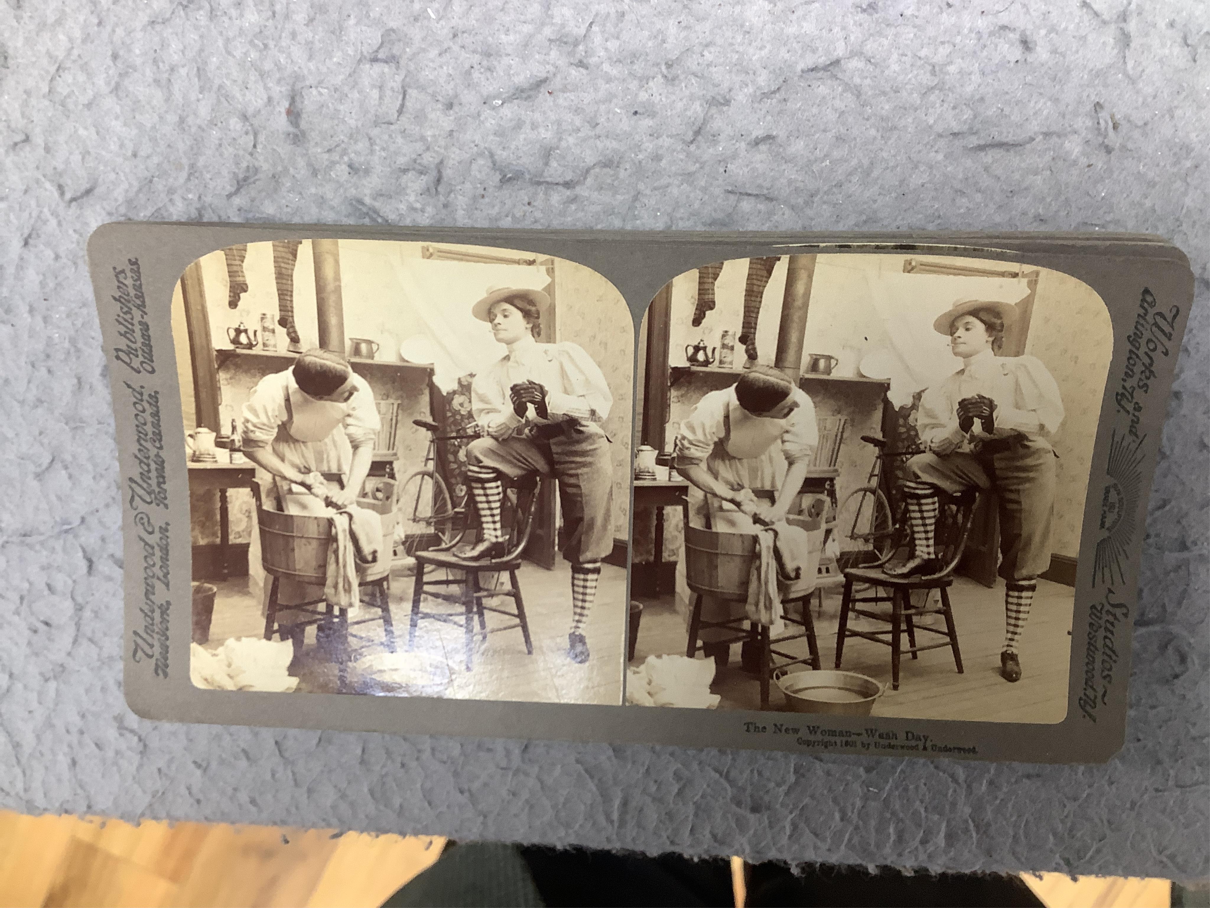 A stereoscope viewer with a collection of comical viewing cards. Condition - cards - fair/good, viewer - poor